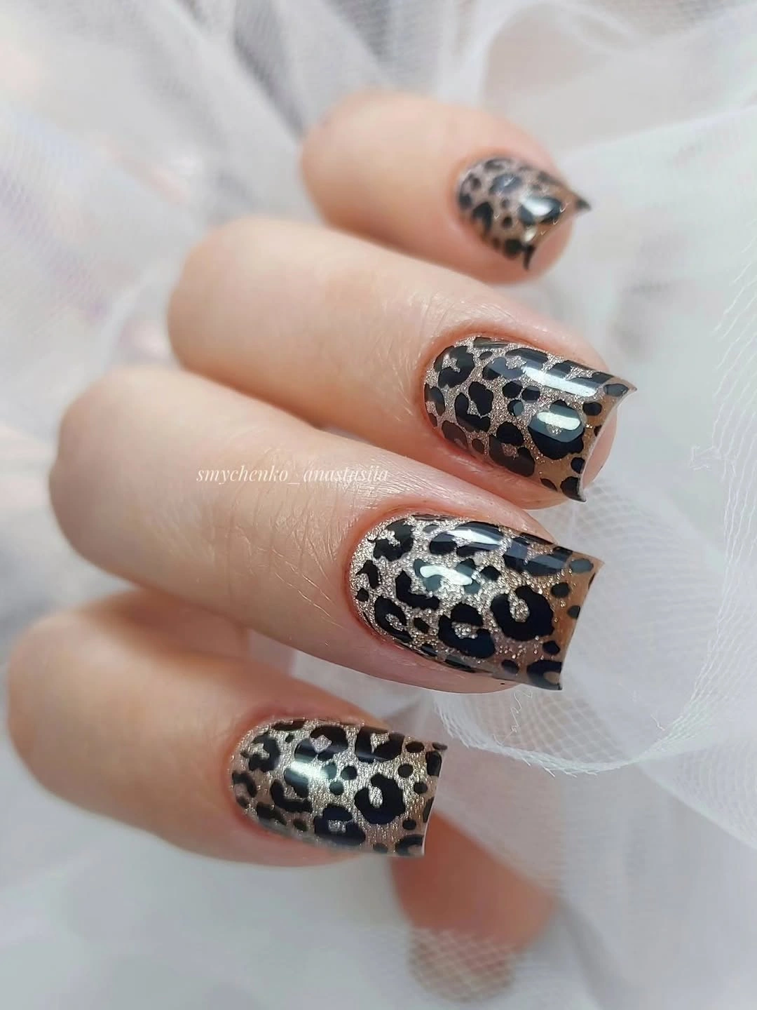 Medium square nails with earthy spotted pattern