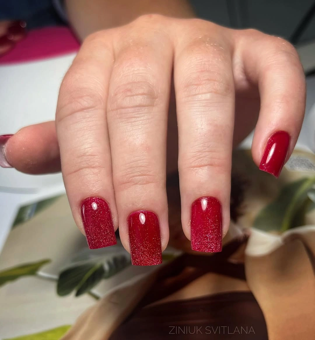 Medium red square nails with fine sparkle