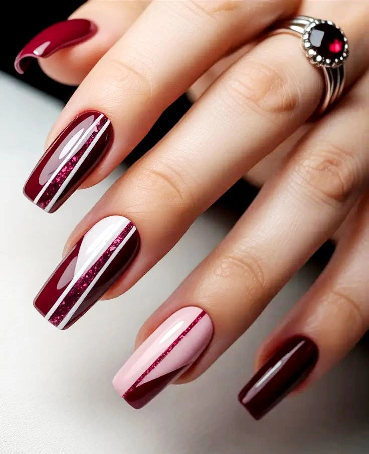 Long burgundy and blush striped square nails