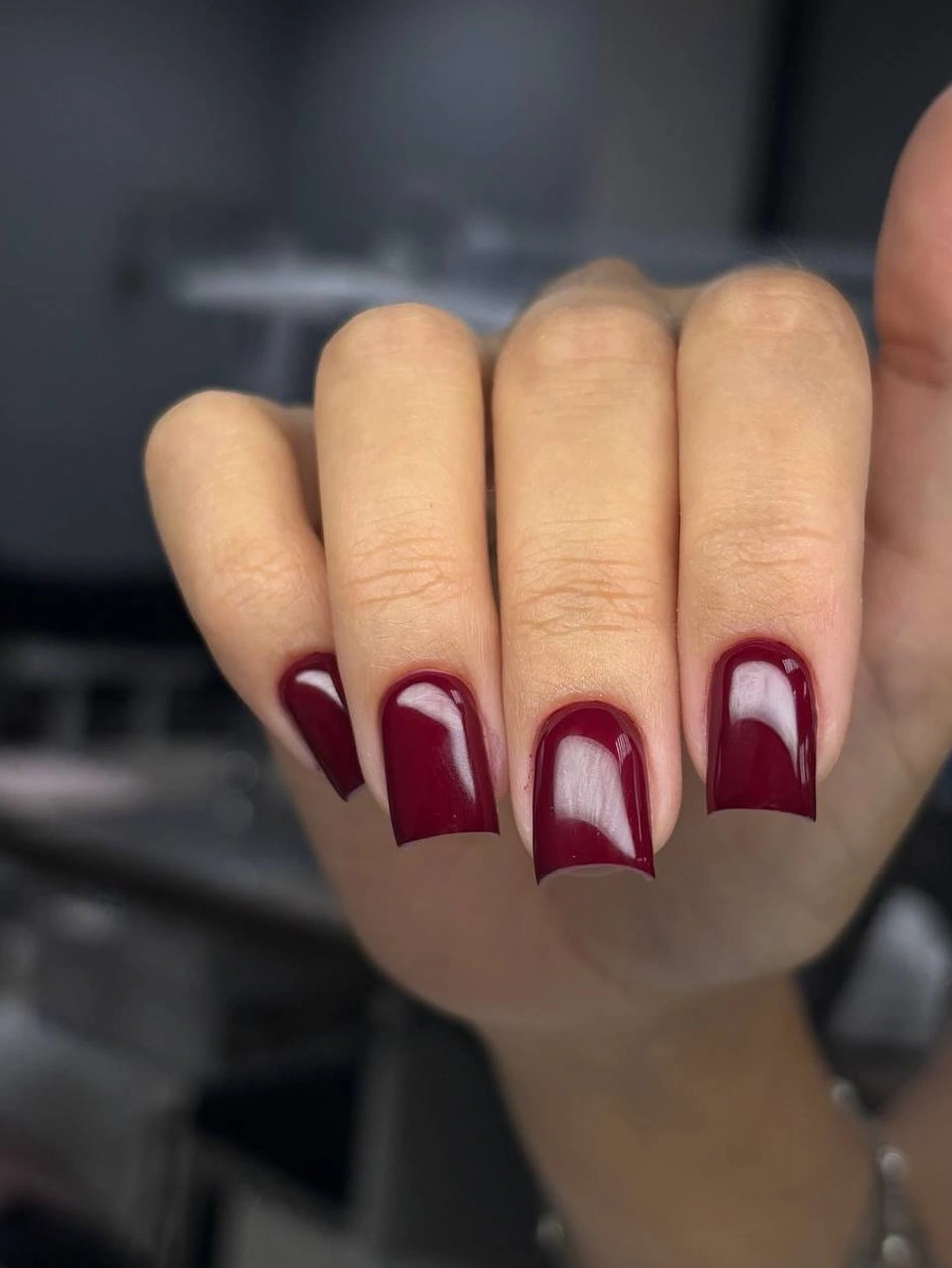 Long burgundy square nails with pale curved space