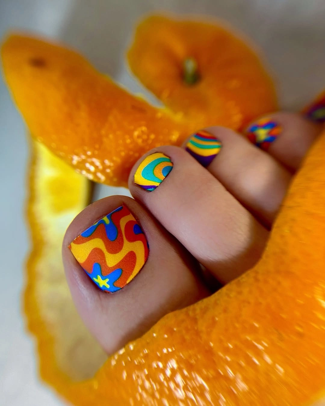 Short square toes with vivid orange blue yellow and red abstract accents