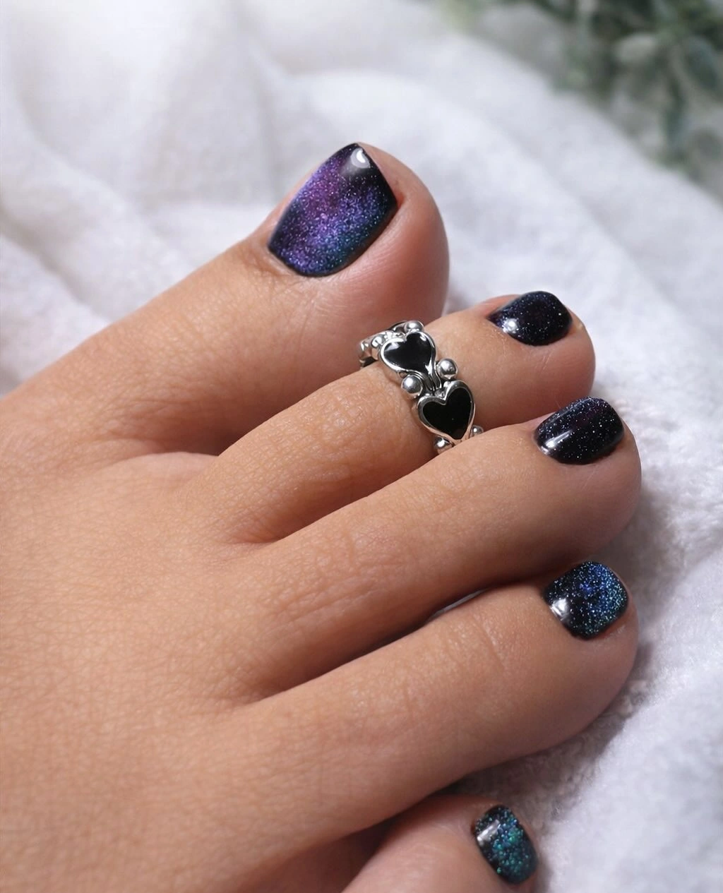 Short square toes in blue-black shimmer with purple reflective shift