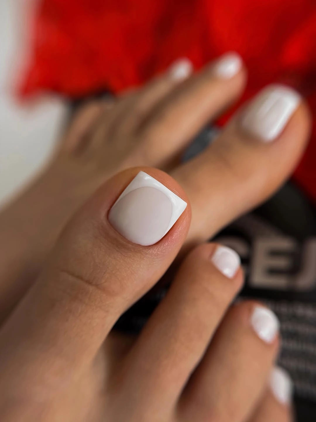 Creamy white square toes with tiny red heart accents
