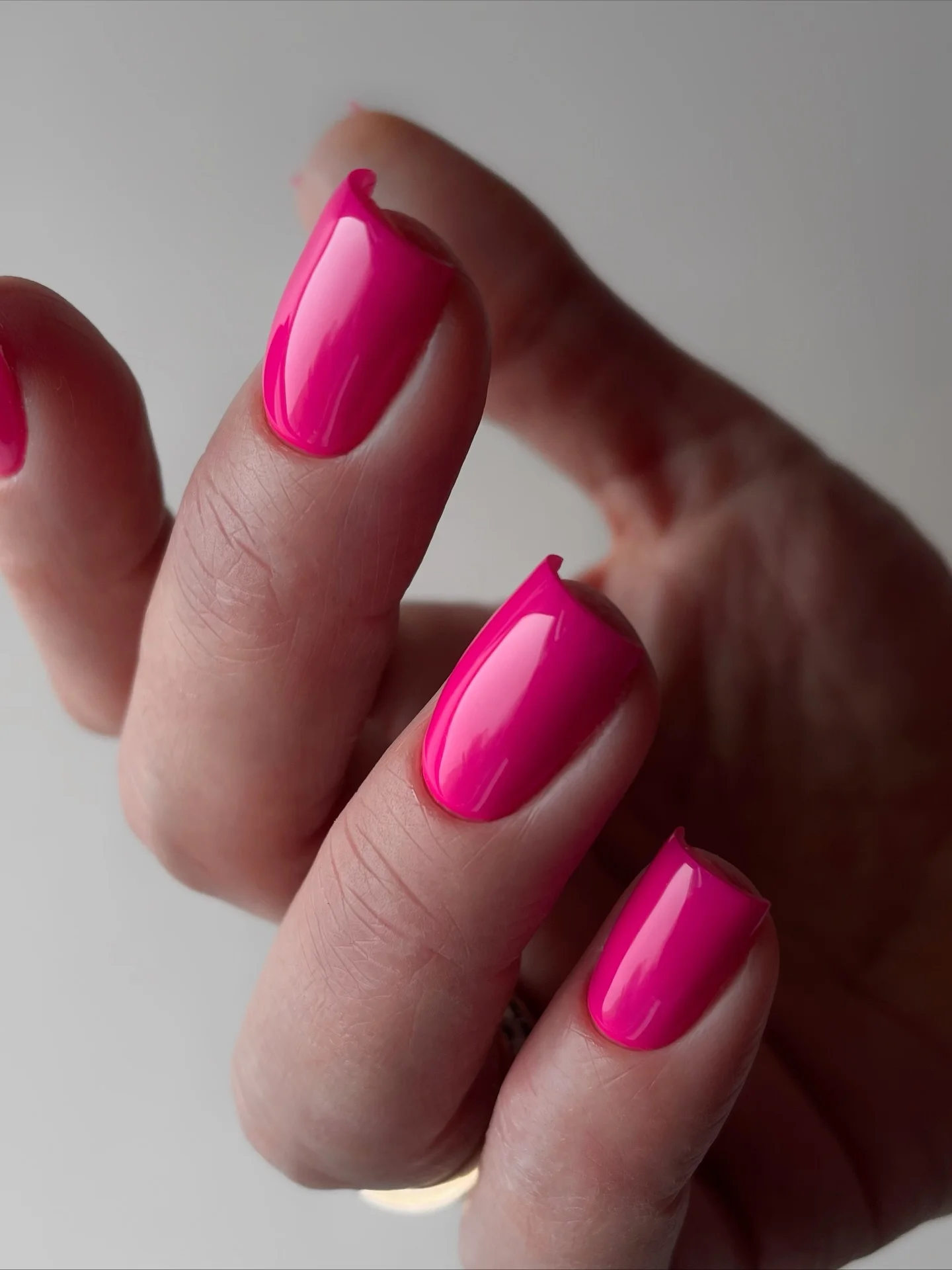 Short hot pink square nails with high gloss