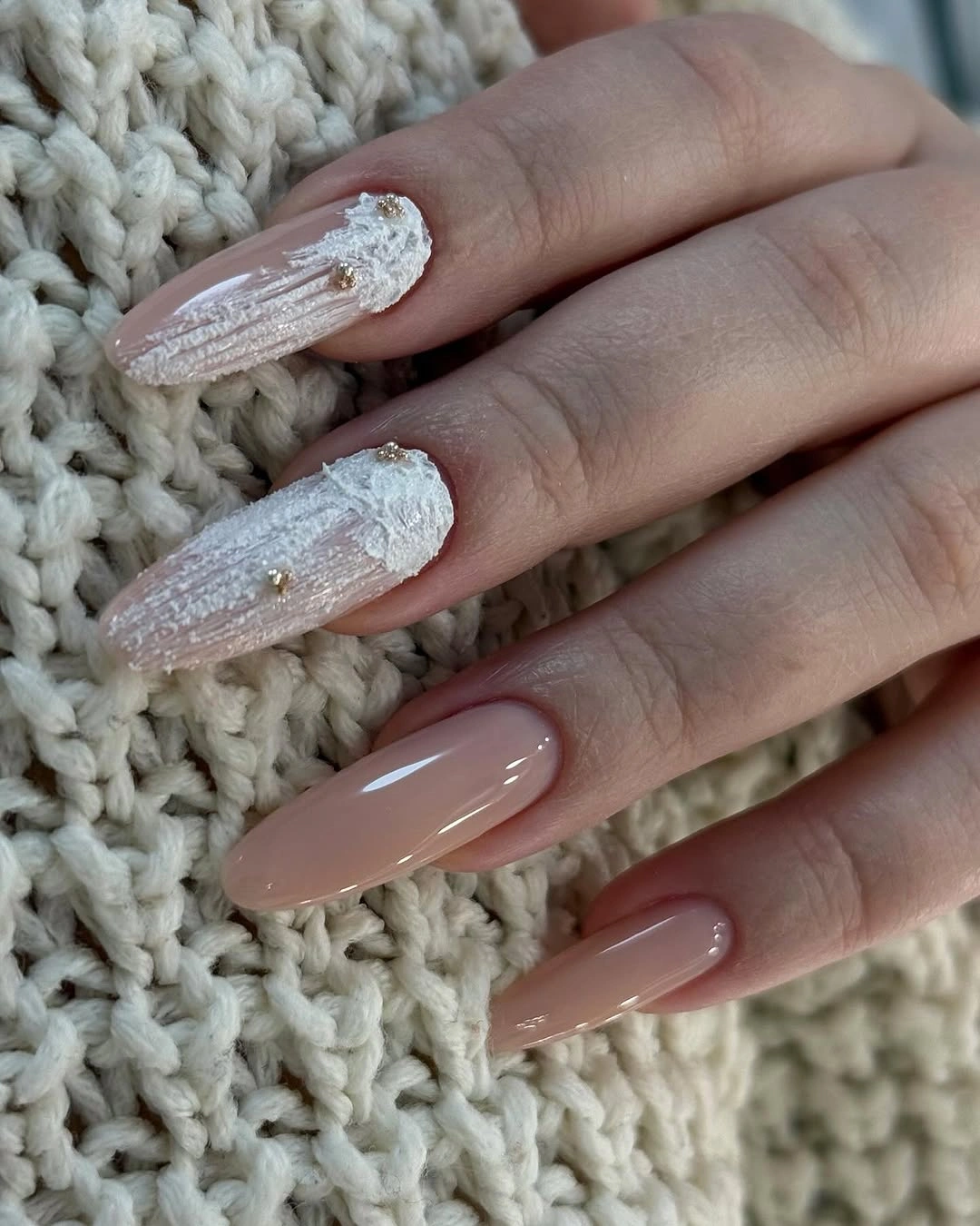 Nude almond nails with raised white texture
