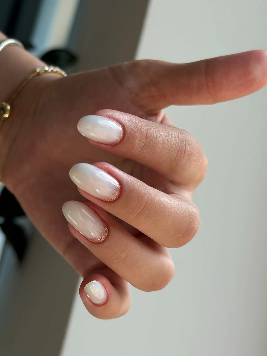 Pearly milky almond nails with warm cuticle sparkle
