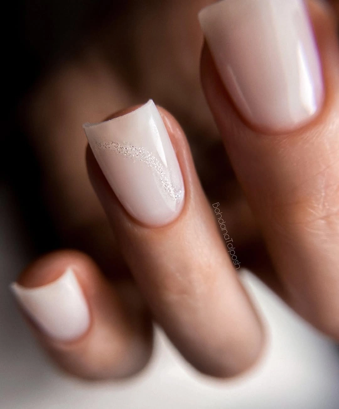 Milky soft square nails with one shimmer curve