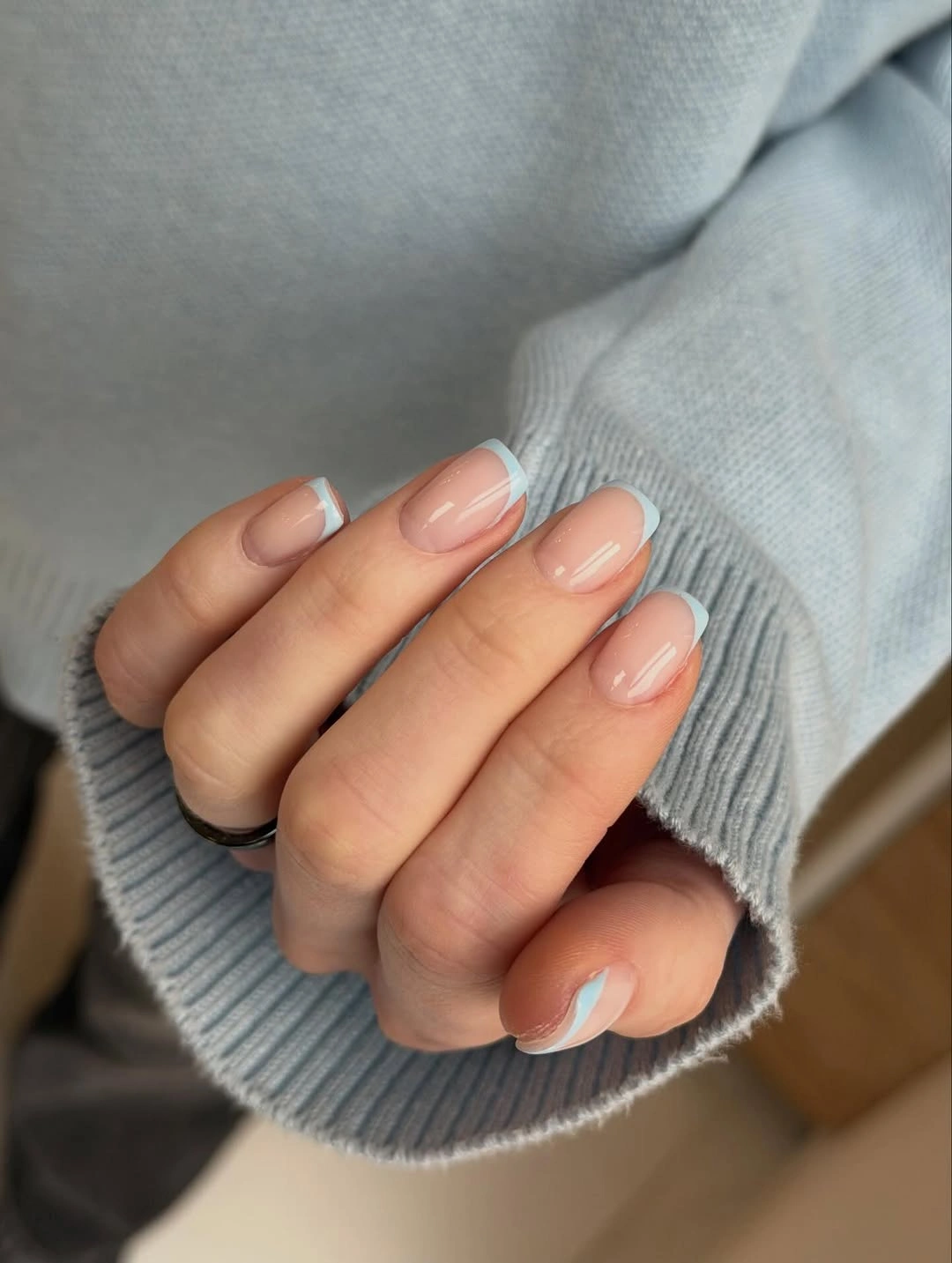 Pale blue French tips on short square nails