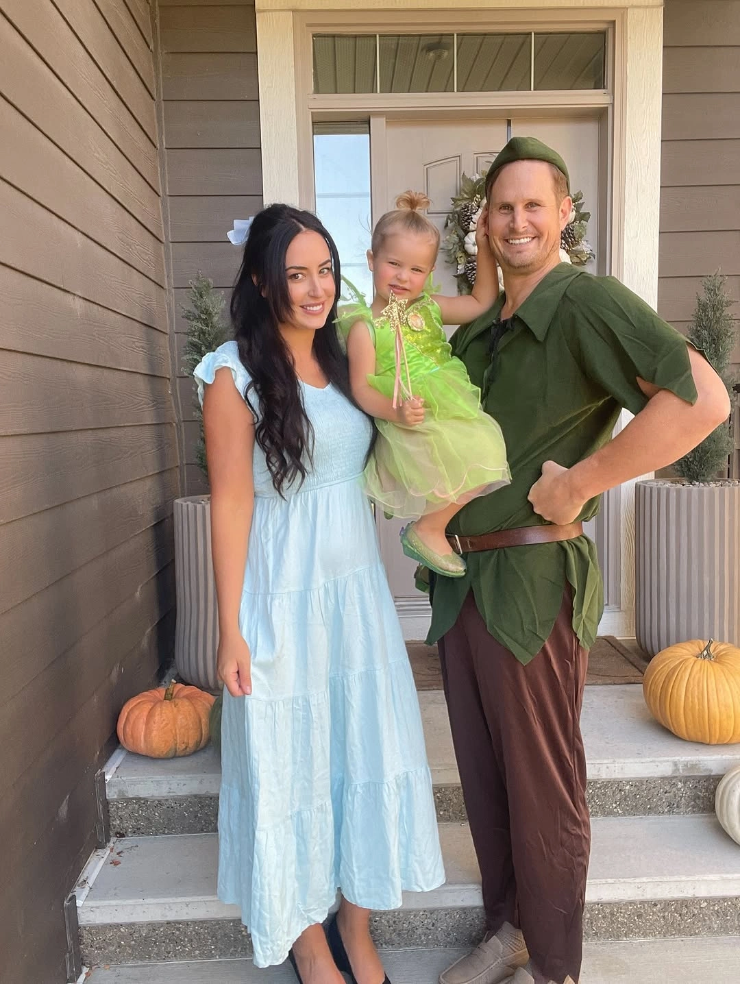 Family costumes with blue dress green tunic and fairy detail