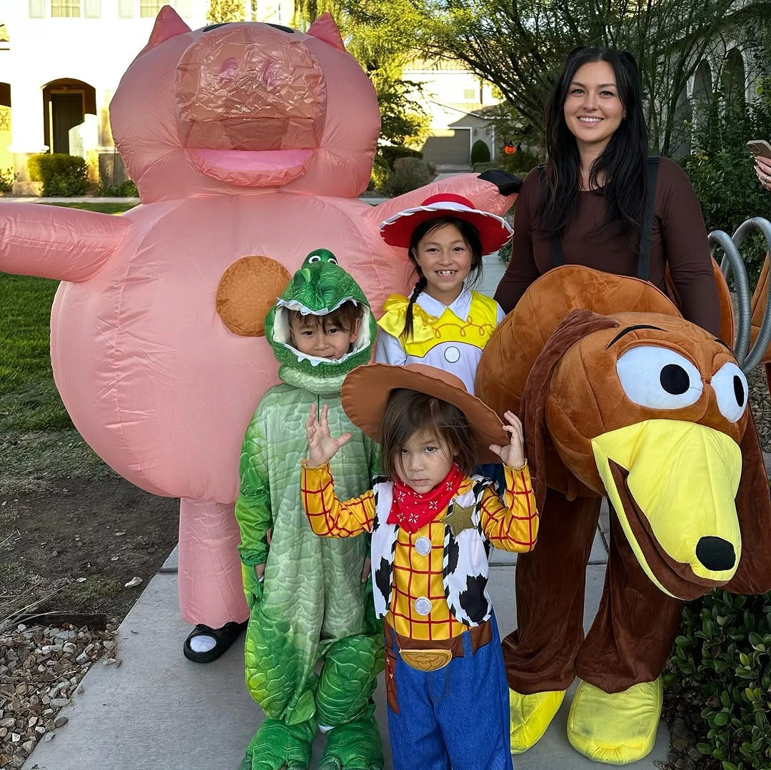 Family costumes with inflatable pink brown characters and bright kids outfits