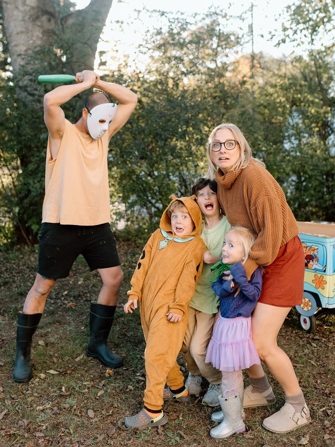 Family costumes with animal masks warm brown layers and purple accent