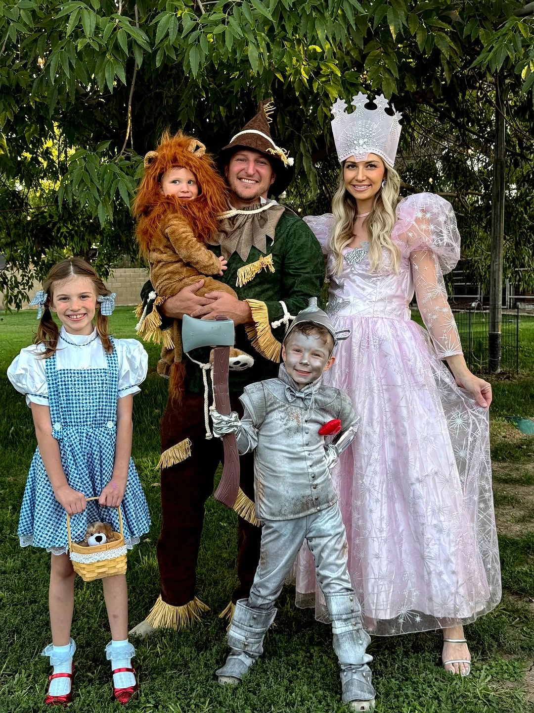 Family costumes with blue gingham lion mane and pointed hat