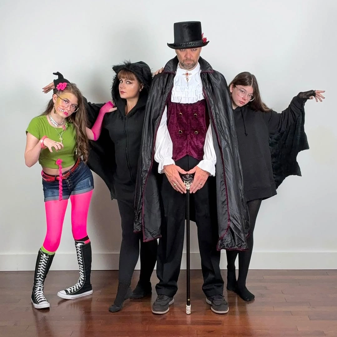 Indoor family costumes with capes tall hat and vivid colors