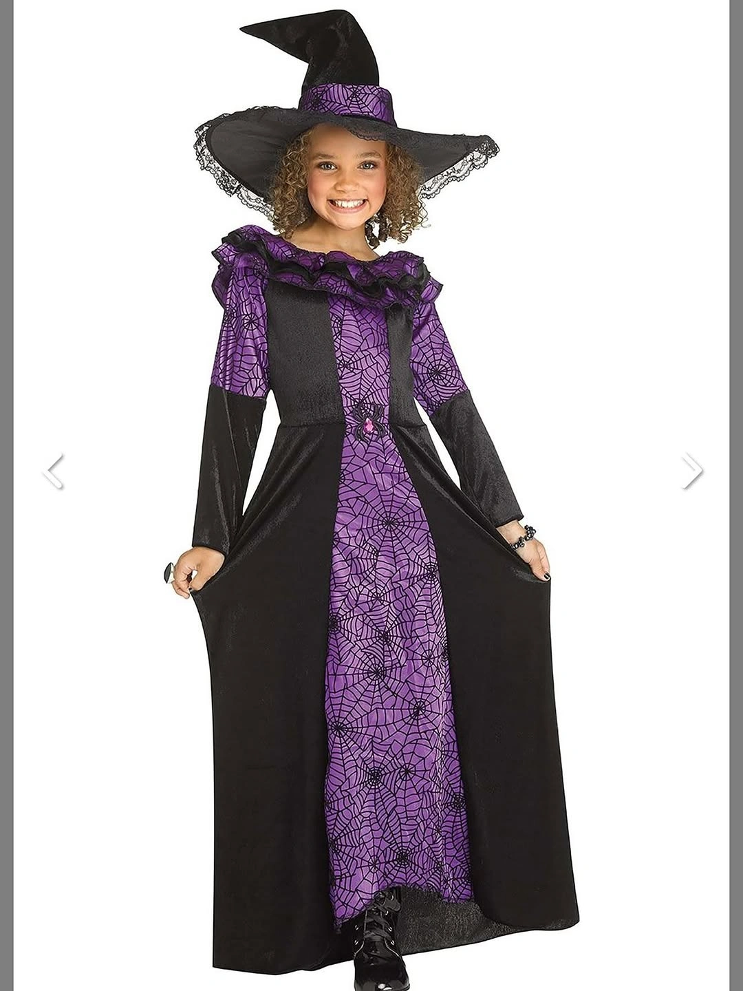 Girl in long black purple witch gown with wide pointed hat