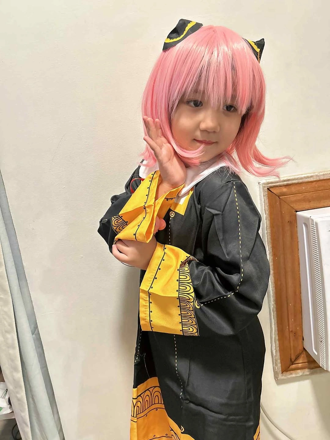 Girl costume with bright pink wig black layers and yellow accent