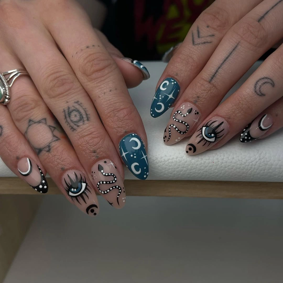 Long almond nails with nude blue pink eyes and abstract art