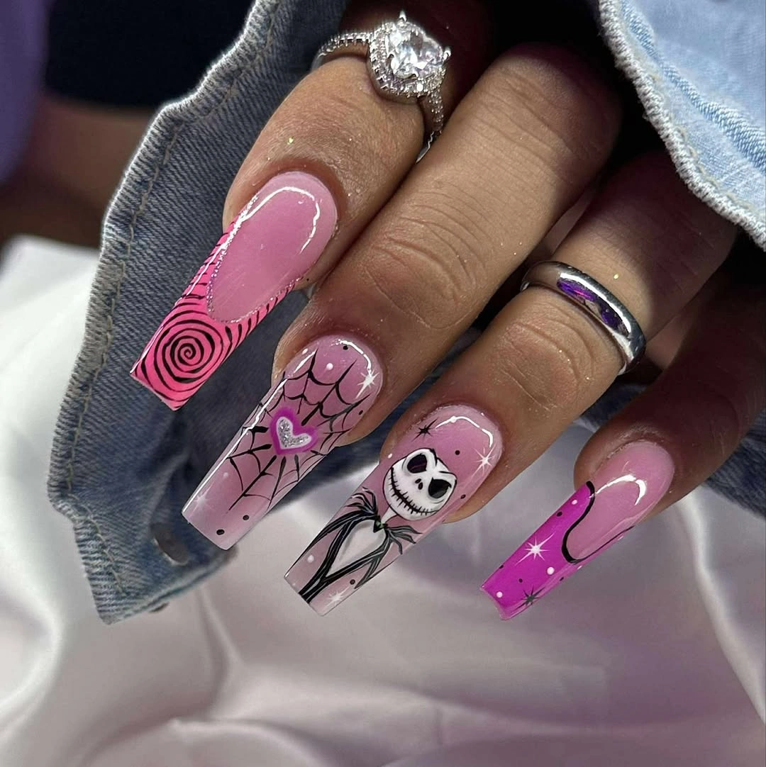 Very long pink coffin nails with red black graphic art