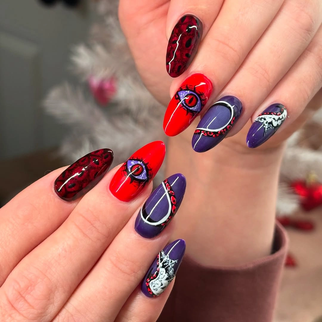 Red and navy almond nails with framed Halloween details