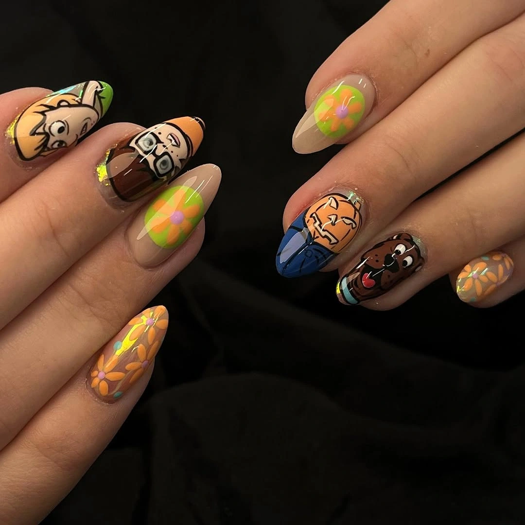 Medium almond nails with neon green orange and dark characters