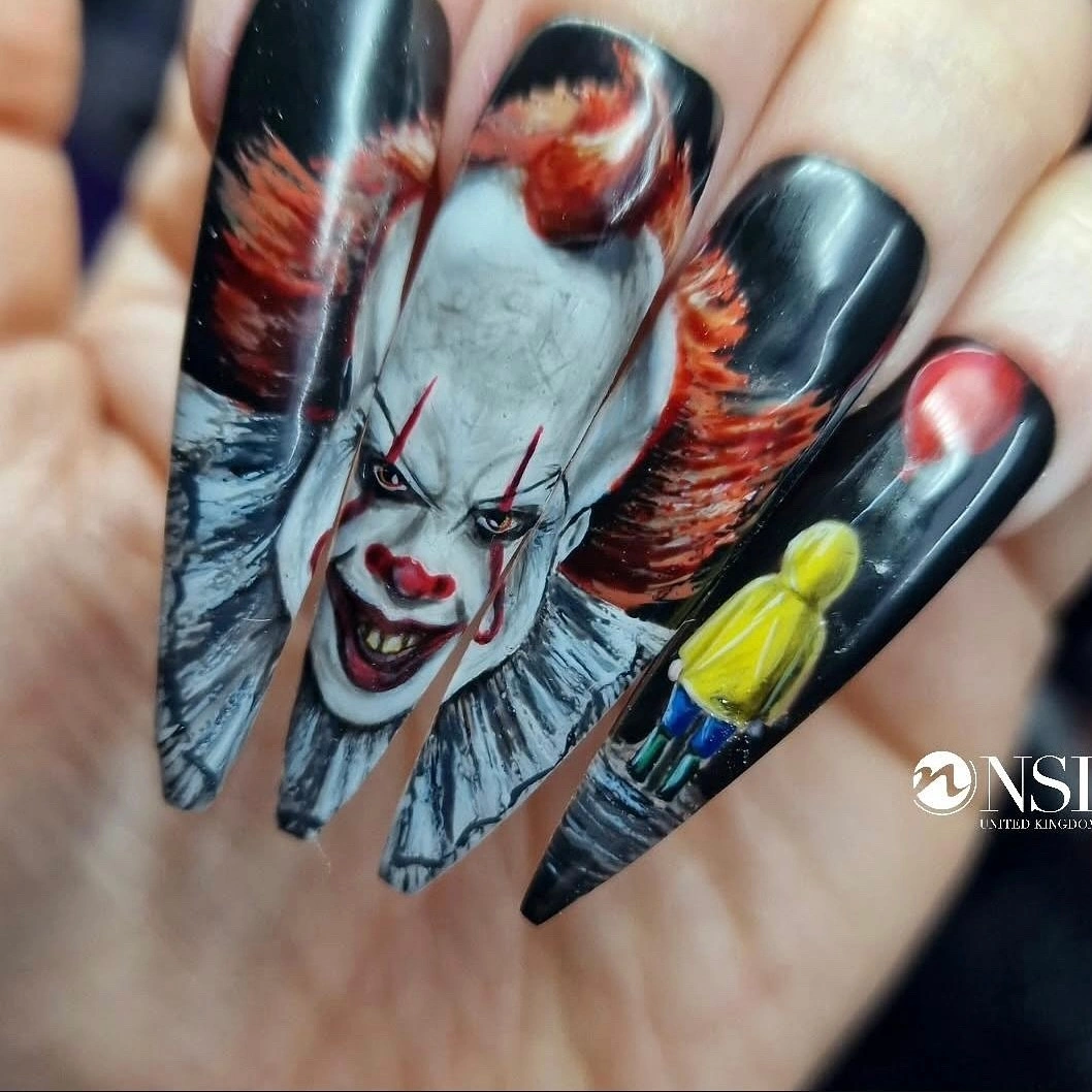 Glossy black nails with a detailed red white horror portrait