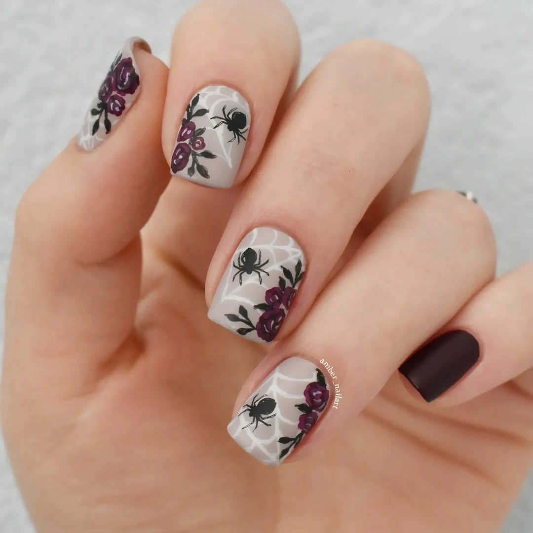 Short cream nails with dark botanical and burgundy details
