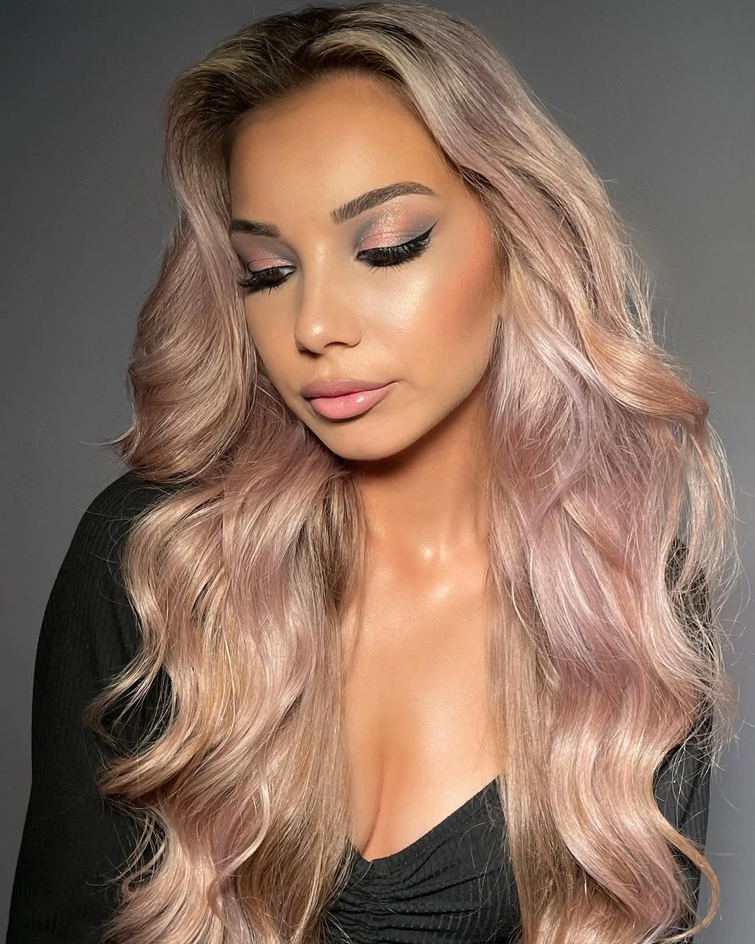 pale pink blonde middle part with wide mermaid waves