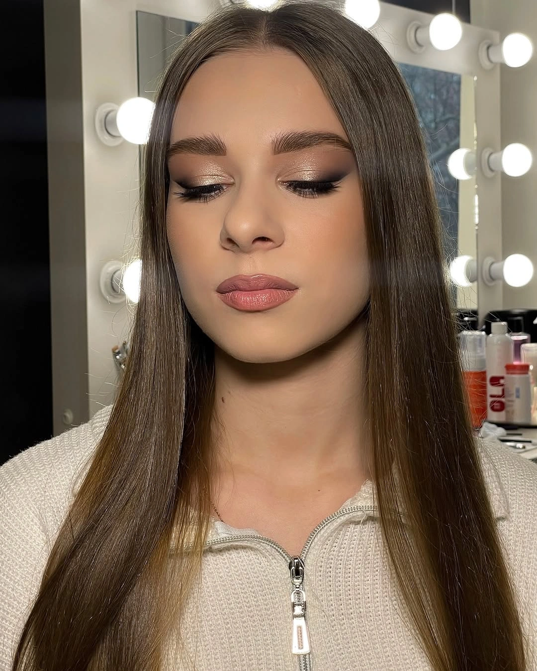 straight medium brown hair with an exact middle part
