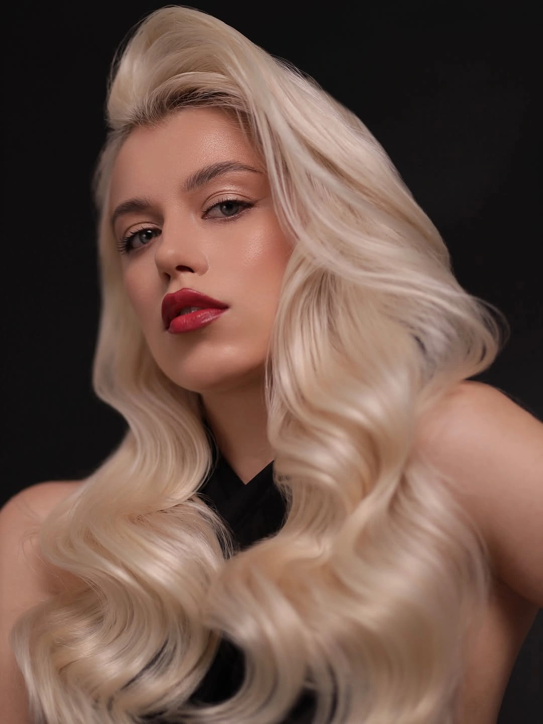 platinum blonde sculpted waves with dramatic swept front