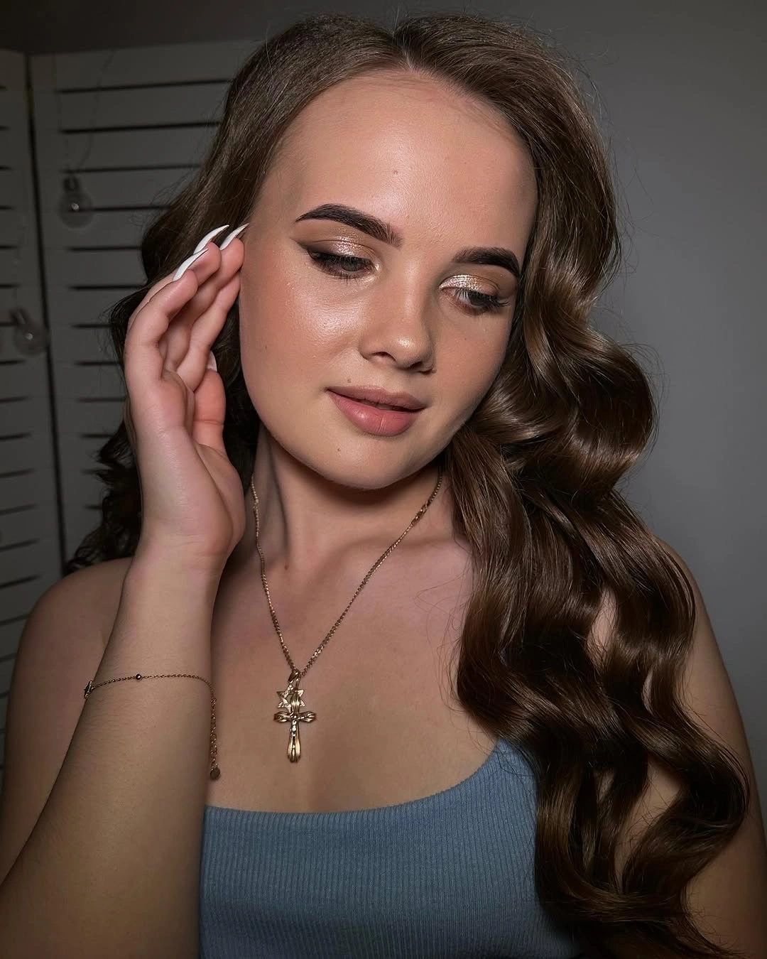 long brunette middle part with one pronounced face curl