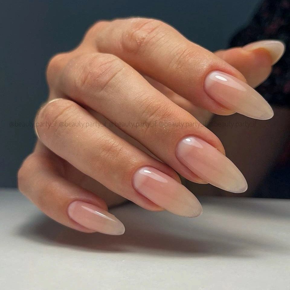 Long pale pink glossy almond nails