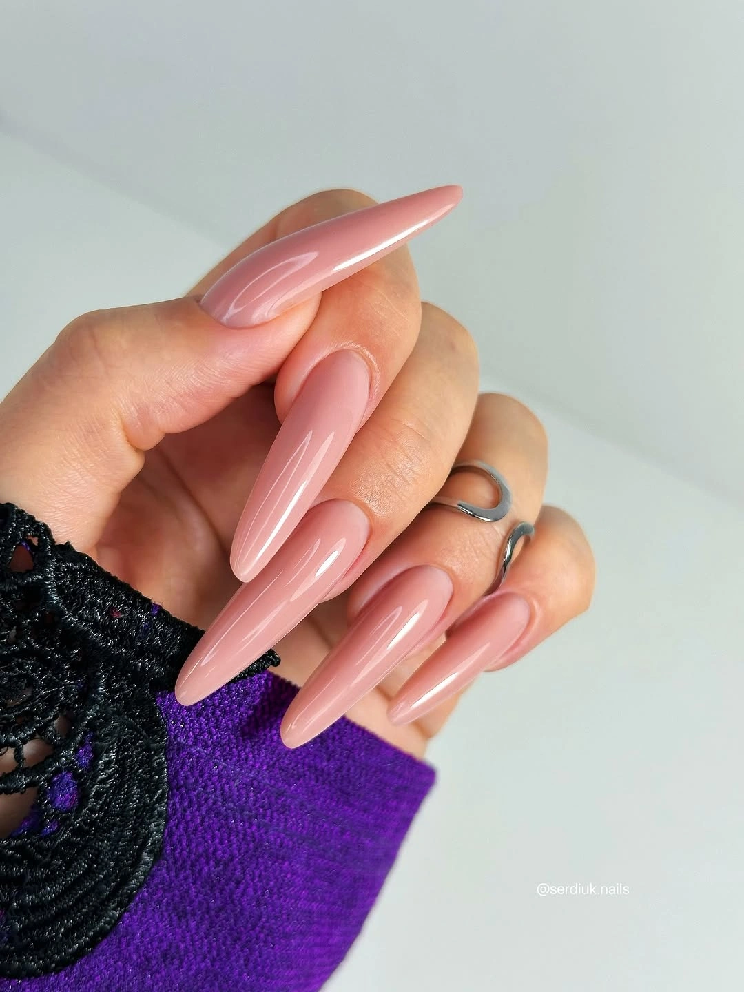 Long pointed glossy pale pink nails