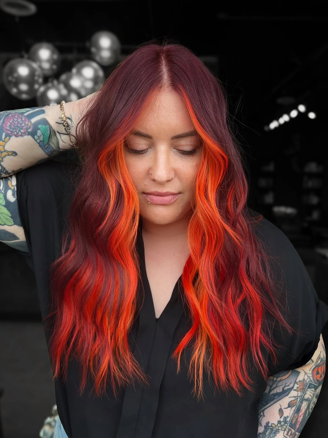 Long red waves with bright orange-red face-framing pieces