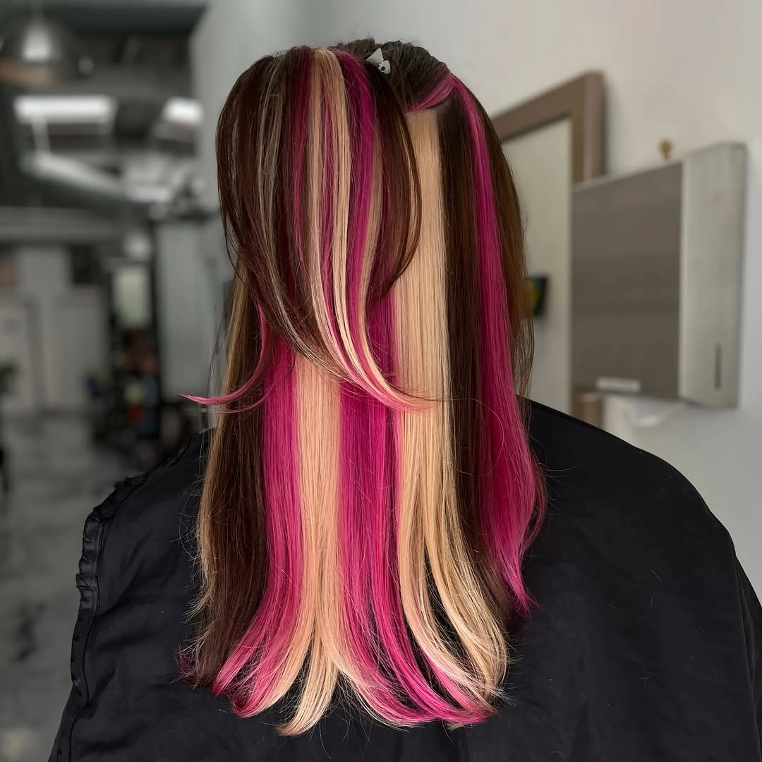 Dark layered hair with blonde and hot-pink face-framing panels