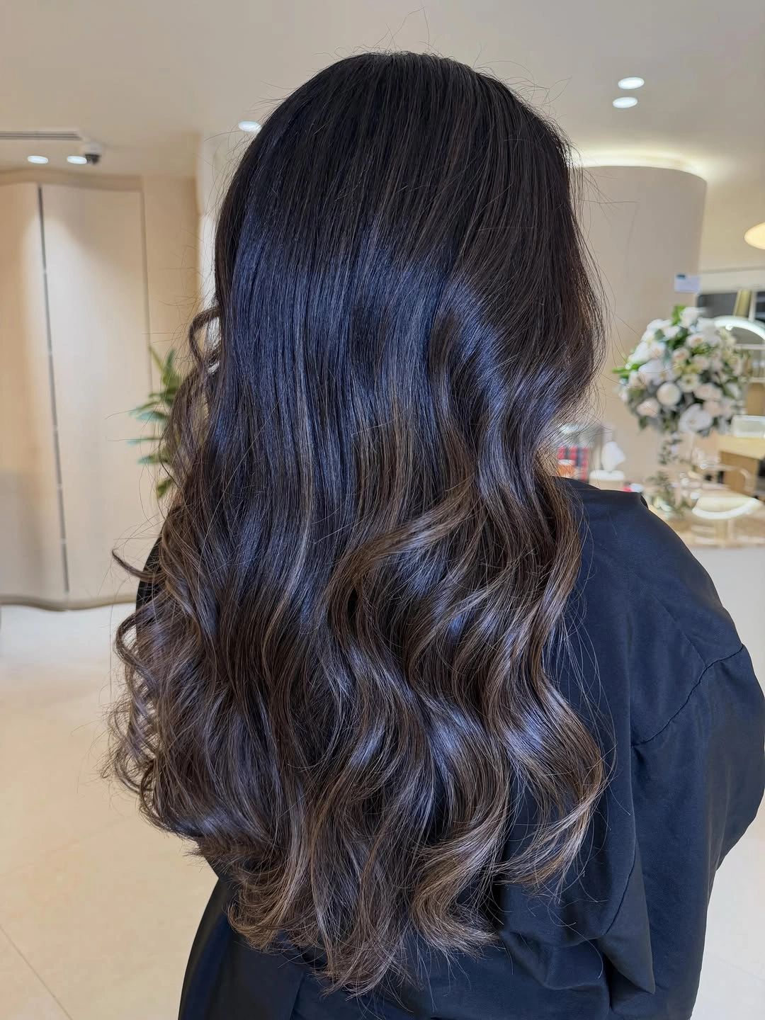 Dark long waves with cool blue-violet highlight ribbons