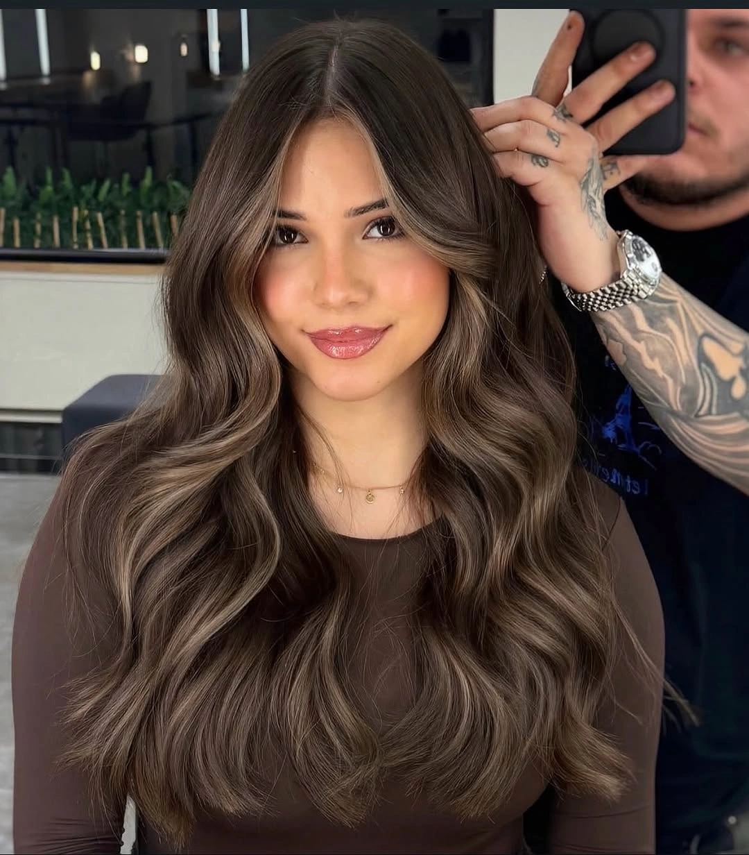 Long mushroom-brown waves with soft face-framing layers