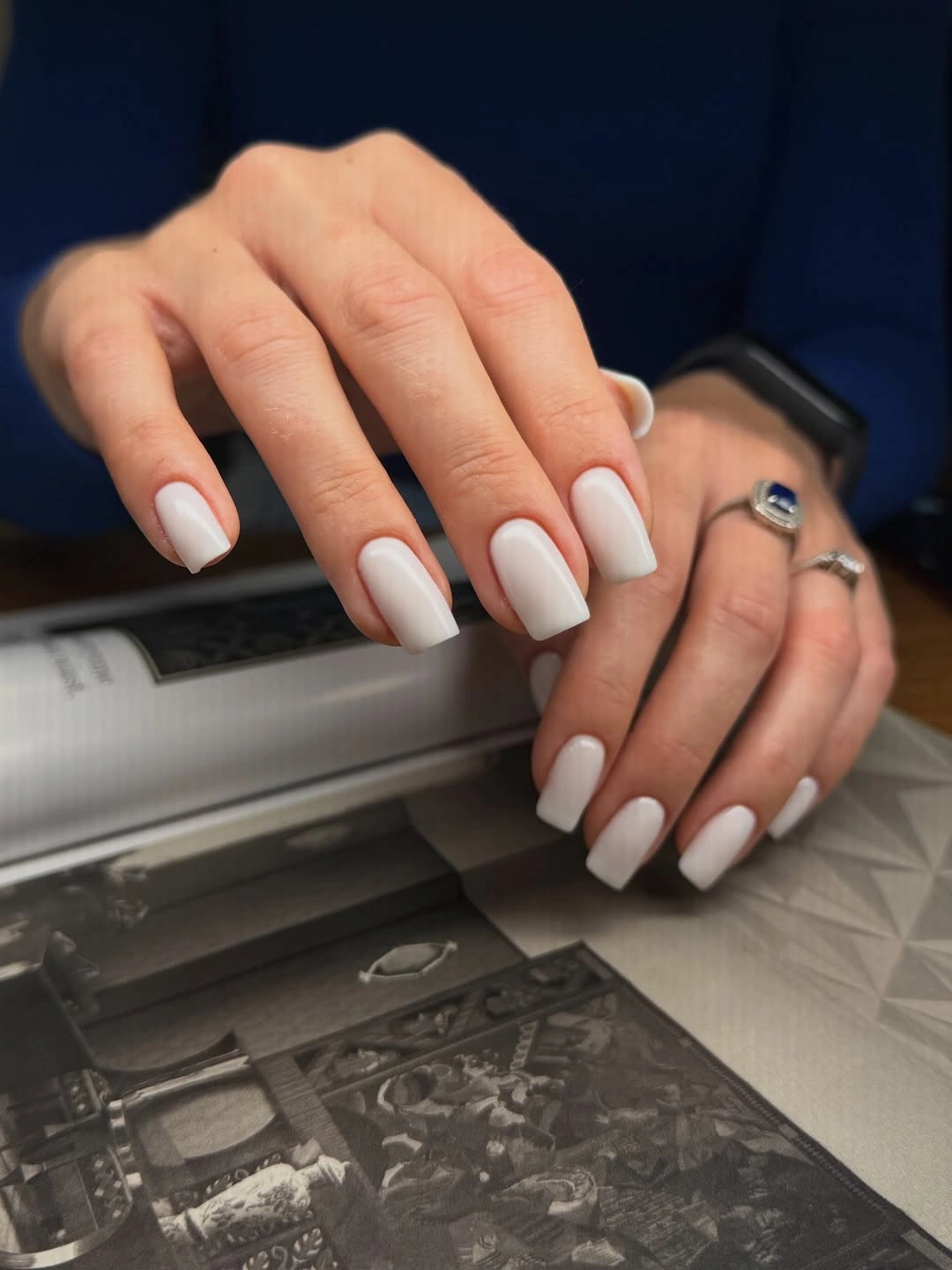 Short bright white rounded square nails with glossy coverage