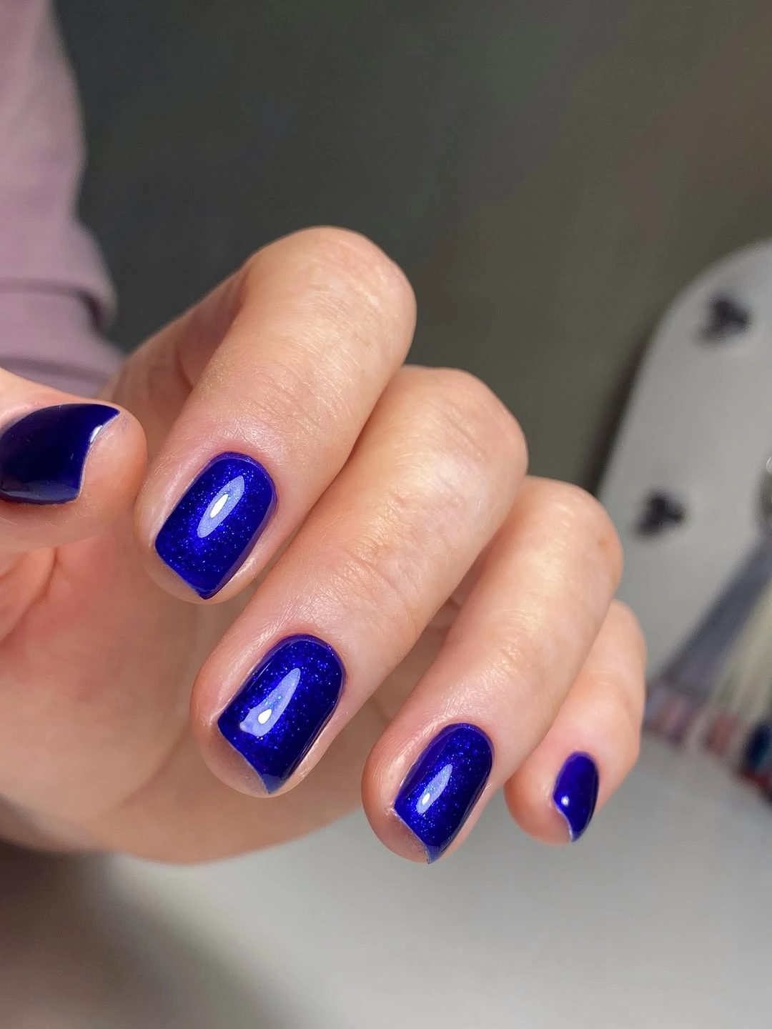 Short rounded square nails in vivid glossy cobalt blue