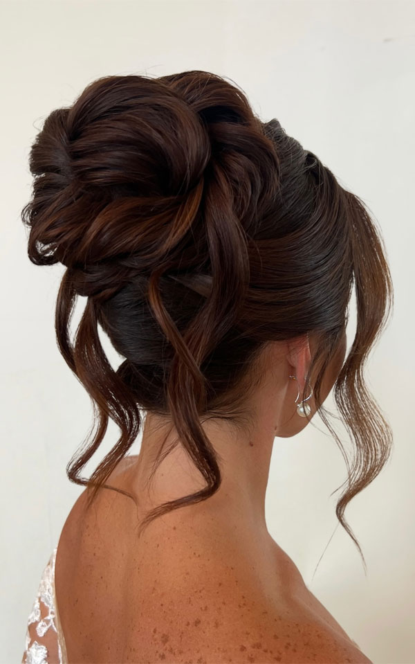 Textured Dark Brown Updo With Ornate Accessory — Winter Formal Hairstyles