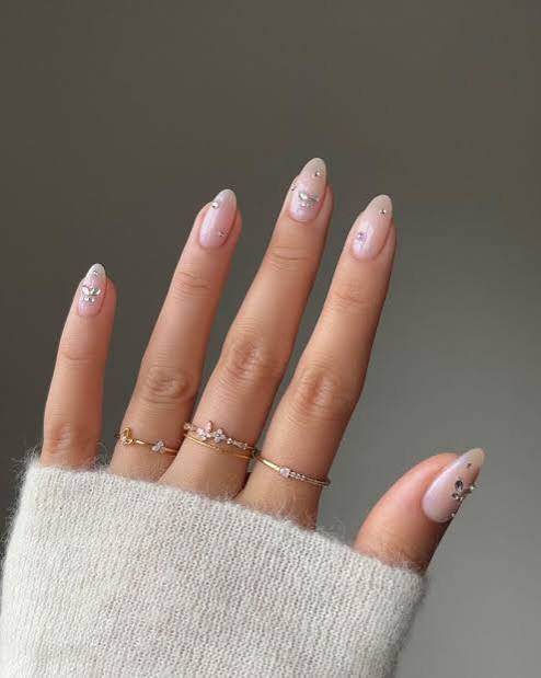 Sheer Pink Almonds with Butterfly Charms Sheer Pink Almonds with Butterfly Charms — Winter Nail Colors for Women Over 40