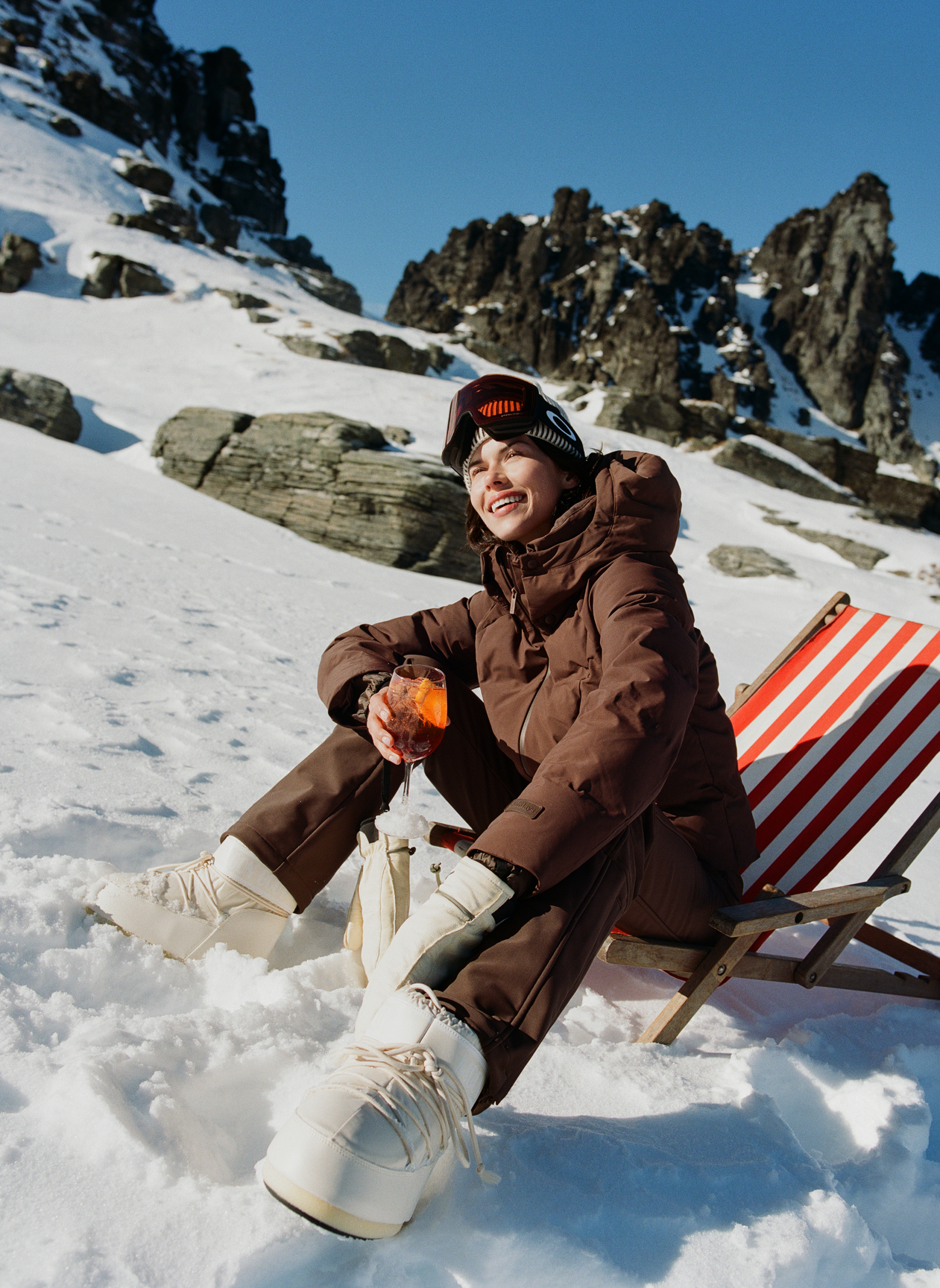 Cozy Winter Warmth: Brown Puffer Jacket and White Snow Pants Cozy Winter Warmth: Brown Puffer Jacket and White Snow Pants — Snowboarding Outfits