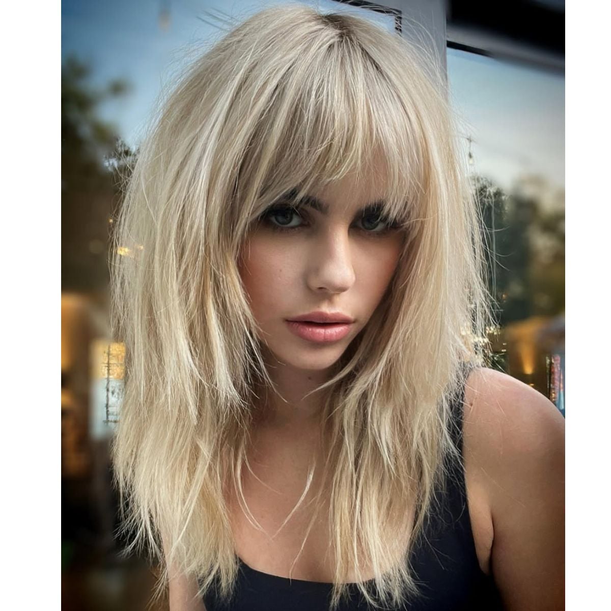 Ash Blonde Mid-Back Shag With Full Bangs Ash Blonde Mid-Back Shag With Full Bangs — Winter Shag Haircuts