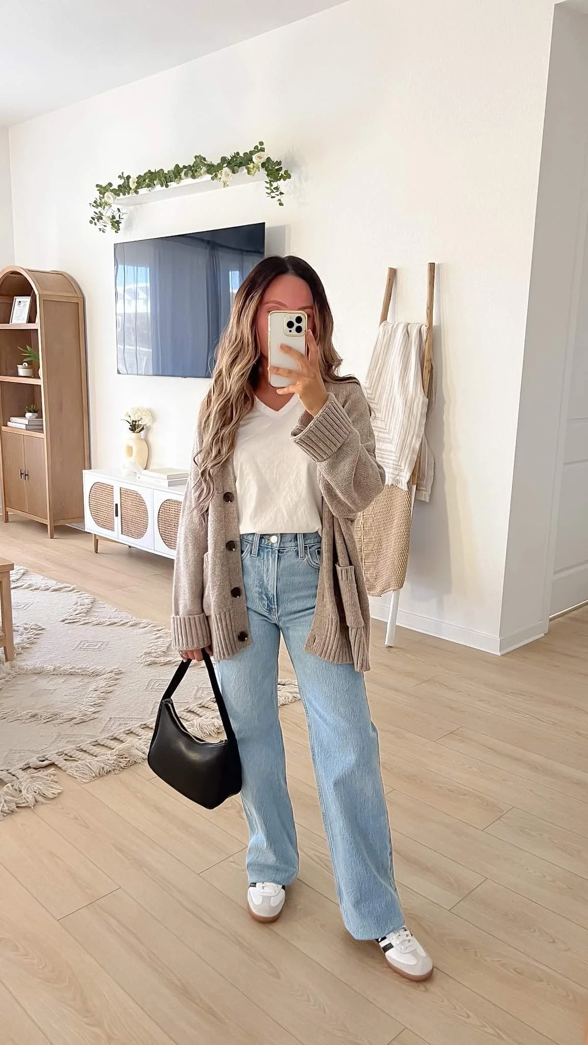 Beige Knit Cardigan Over White Tee and Wide-Leg Jeans — Winter to Spring Transition Outfits