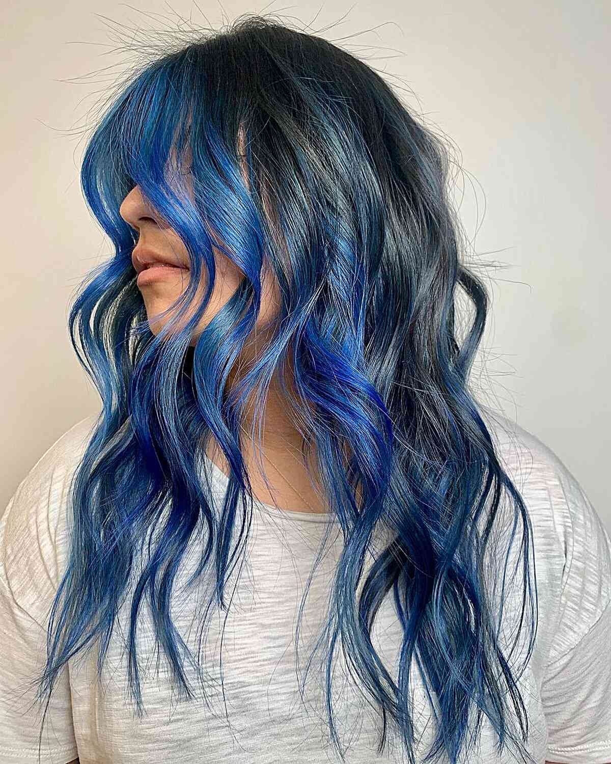 Dark Base with Vibrant Blue Streaks — Winter Hair Colors for Blue Eyes