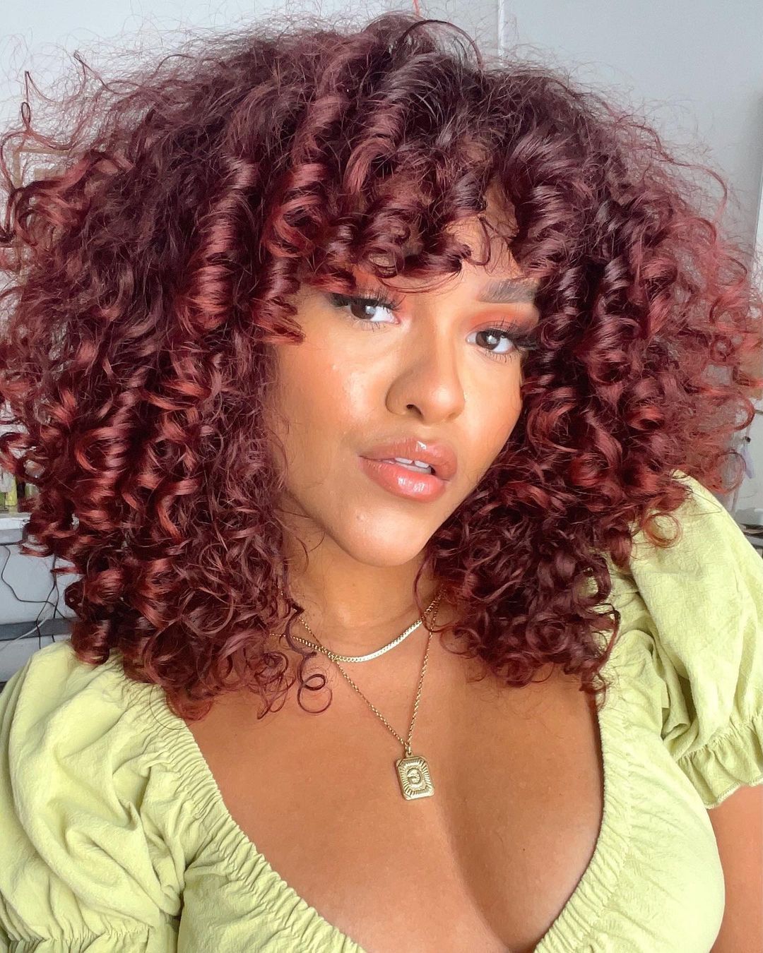 Deep Cherry Red Curls with Curly Bangs Deep Cherry Red Curls with Curly Bangs — Winter Red Hair Colors