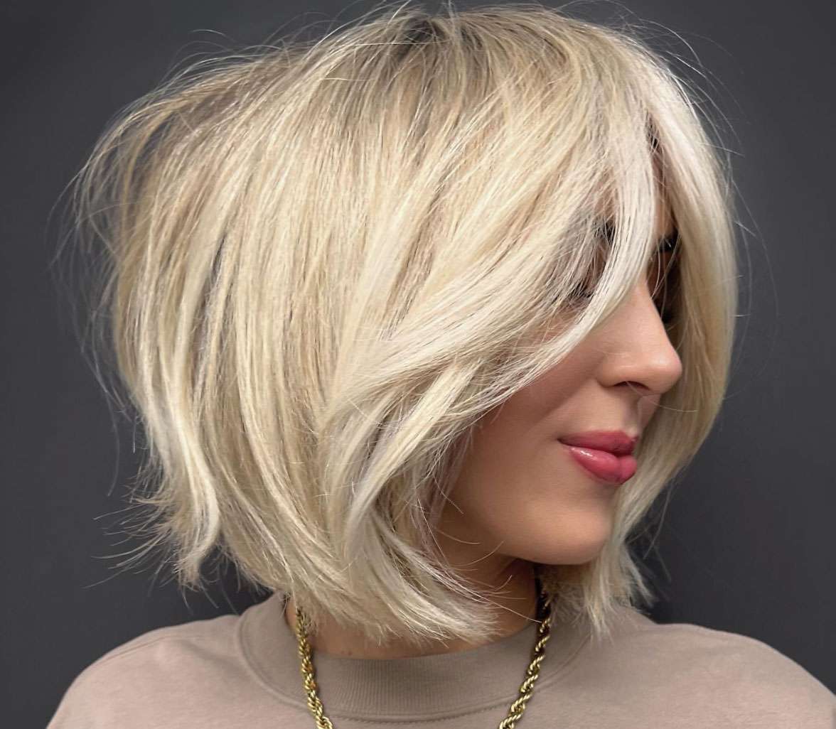 Ash Blonde Shaggy Bob With Wispy Bangs Ash Blonde Shaggy Bob With Wispy Bangs — Winter Haircuts for Straight Hair