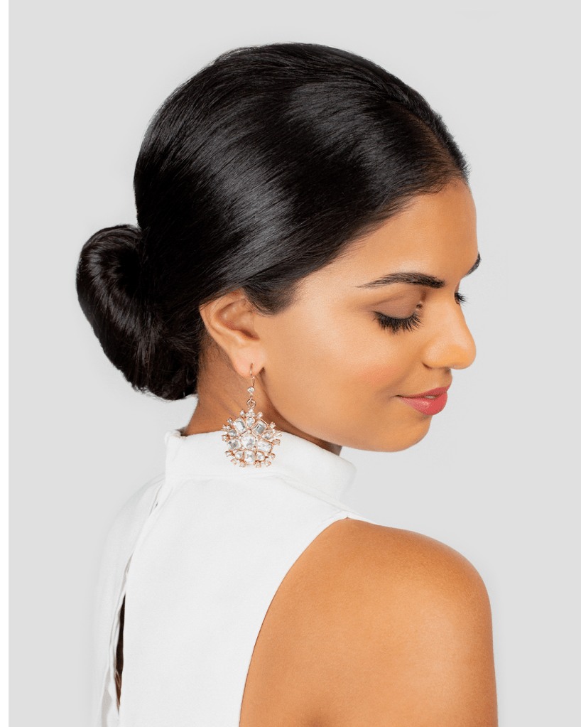 Sculpted Dark Brown Low Bun — Winter Wedding Guest Hairstyles