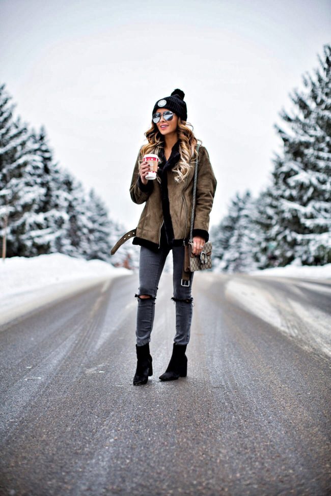 Olive Suede Jacket with Ripped Jeans for Edgy Snow Day Style — Snow Day Outfits