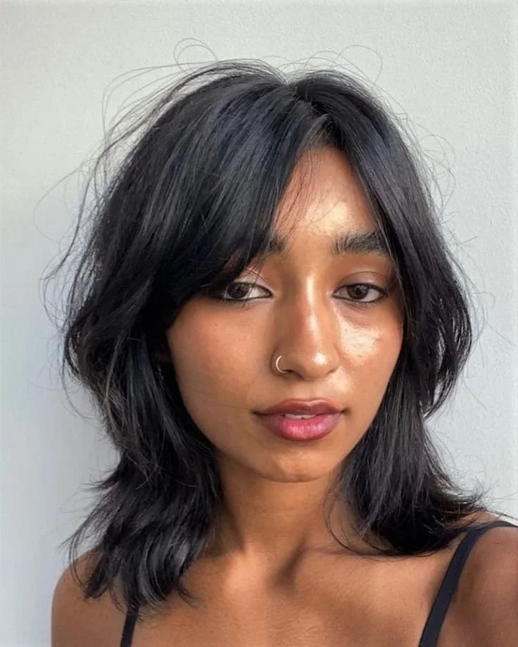Collarbone Shag With Curtain Bangs Collarbone Shag With Curtain Bangs — Winter Haircuts for Wavy Hair