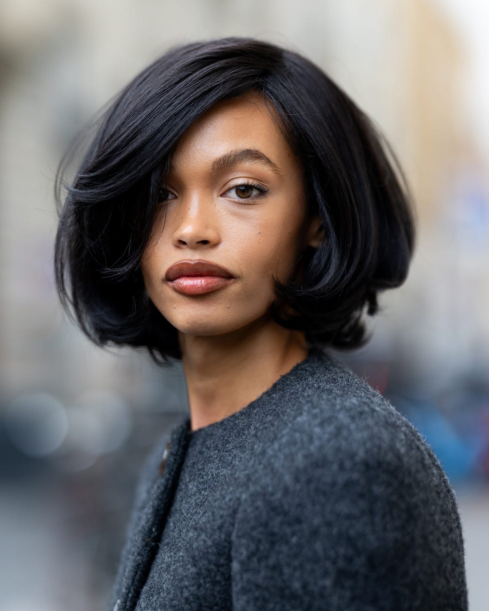 Black Chin Length Bob With Voluminous Side-Swept Bangs Black Chin Length Bob With Voluminous Side-Swept Bangs — Medium Length Winter Haircuts