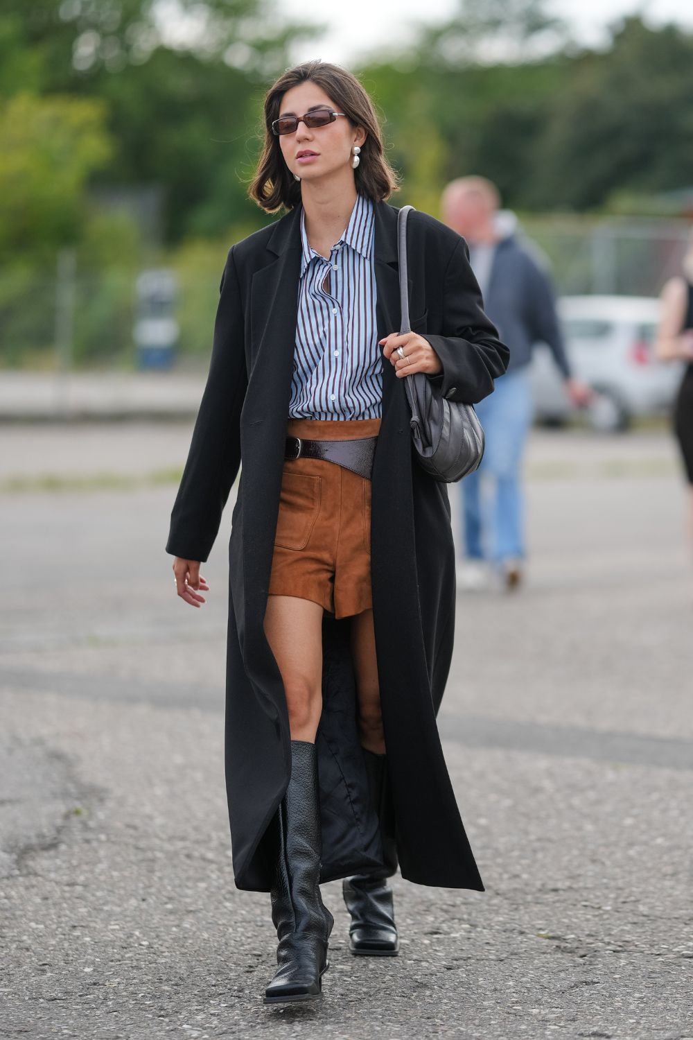 Edgy Street Style: Brown Shorts with Striped Shirt and Black Coat — Brown Boots Outfits